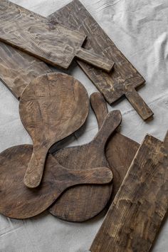 wooden spoons and spatulas laid out on a table