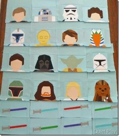 star wars cut outs are displayed on a blue paper plate with the faces of different characters