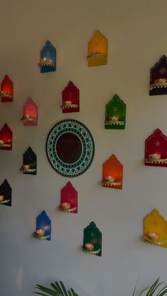 the wall is decorated with brightly colored lanterns and candles for diwaling or decorating