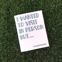 a sign that is laying in the grass with some words written on it, i wanted to visit in person but