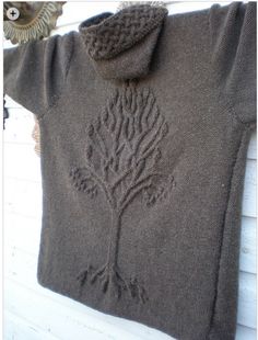 a sweater with a tree drawn on it