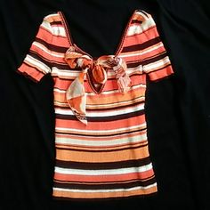 Vn Elegant Flirty Blouse Of Cotton Blend In Orange Stripe. The V Cut With The Silk Bow Are In The Back. The Front Has A Scoop, But It Can Be Worn Either Way. Has Very Nice Stretch. Never Worn. Fitted Orange Tops, Fitted Elegant Orange Blouse, Elegant Fitted Orange Blouse, Elegant Orange Summer Tops, Elegant Orange Summer Top, Chic Fitted Orange Blouse, Chic Orange Fitted Blouse, Retro Orange V-neck Top, Fitted Burnt Orange Top For Summer