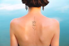 a woman with a tattoo on her back