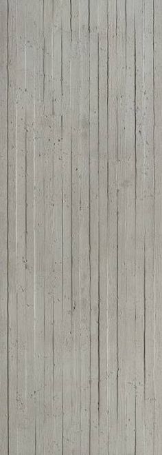 a person sitting on a bench in front of a wall with vertical lines painted on it