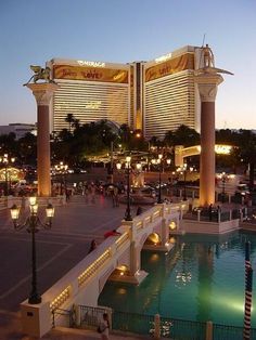 the las vegas hotel and casino is lit up at night