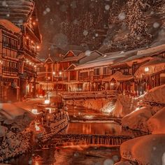 an image of a snowy town at night