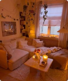 a living room filled with furniture and candles