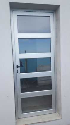 a white door with glass on the outside