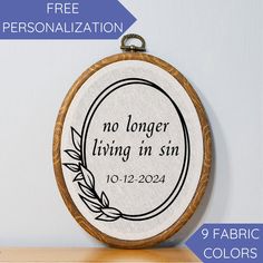 a cross stitch pattern with the words, no longer living in sin and a circle frame