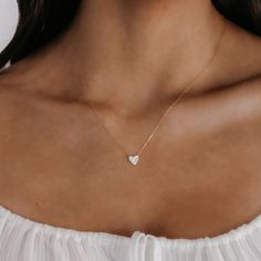 This 18K yellow gold pave' diamond heart necklace floats on an adjustable cable link chain. This luxurious staple is sure to send a message to your loved one. Curate an eye-catching statement look by matching this with the other natural beauties from our Diamond Jewelry Collection. Natural Diamonds: 0.20ctw 18K Yellow Gold Length: 18 Inches