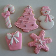 decorated cookies with pink frosting and white icing