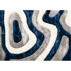 the rug is blue and grey with white swirls on it's sides, as well as an abstract design