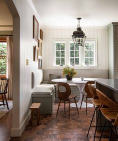 a kitchen with a table and chairs in it