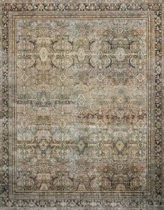 an antique rug with many different colors and patterns