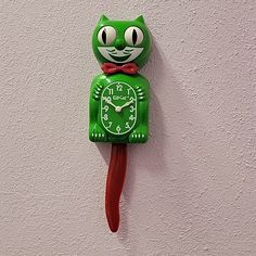 Kit-Cat Klocks Limited Edition Christmas Kat Classic Green Kit-Cat Clock With Red Tail & Bow Tie Kit Cat Clock Powered By 2 “C” Batteries (Not Included) The Kit-Cat Klock Is 100% American Made. All Kit-Cat Klocks Have The Patented Double Animated Feature Of "Rolling Eyes And Wagging Tail". Each Kit-Cat Klock Comes With Operating Instructions, Warranty & Kit Cat Club Membership Application. Each Original Kit Cat Klock Measures 15 1/2" Tall From The Tip Of Their Ears To The Tip Of Their Tail. Urba Kit Cat Clock, Rolling Eyes, Cat Clock, Wall Decor Christmas, Cat Themed Gifts, Cat Club, Kit Kat, Christmas Wall Decor, Cat Birthday