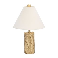 a table lamp with a white shade on it and a gold ball at the base