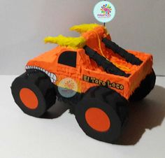 an orange monster truck made out of construction paper