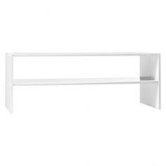 a white shelf sitting on top of a wall