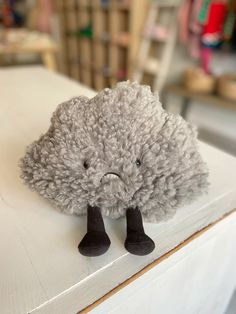 a stuffed animal is sitting on top of a table