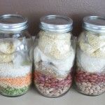 four jars filled with different types of food