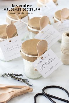 wooden spoons and labels on jars with cotton twine, scissors and paper tags