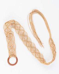 The Bohemian chic trend has made a major comeback and we’re here for it with the Hestia Macrame Belt. This one-size-fits-most style is constructed of Cotton cording and can be worn over a summer day dress, an oversized blouse, or your favorite denim pants. It’s the perfect accessory for a weekend brunch, a music festival, or your summer holiday on the beach. • Natural • 100% cotton cording with round wood buckle • Belt width is 52-55mm • Measures 60” total • One size fits most • Clean with soft, Summer Day Dresses, Leather Belts Men, Weekend Brunch, Oversized Blouse, Macrame Tutorial, Macrame Art, Bohemian Chic, Leather Belts, Personalized Accessories