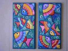 two colorful fish painted on blue tile with bubbles and bubbles around the bottom of them