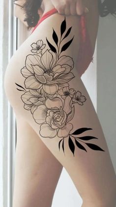 a woman's thigh with flowers on it