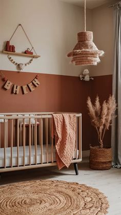 a baby's room with a crib, rugs and decorations on the wall