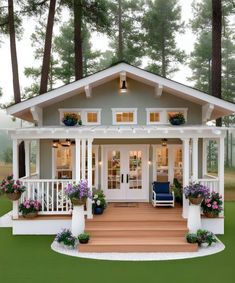 a small house with porches and flowers on the front