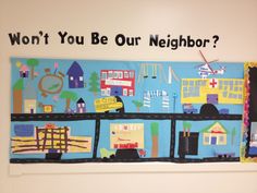 a child's artwork is displayed on the wall in front of a sign that says won't you be our neighbor?