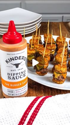 an appetizer with ketchup is on a plate next to other food items