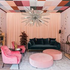 a living room filled with furniture and a chandelier