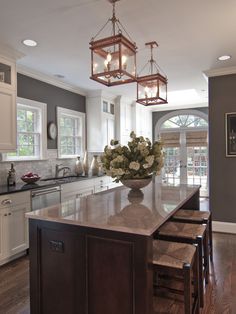 a large kitchen with an island in the middle