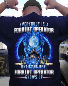 a man wearing a t - shirt that says everybody is a forklift operator until the real forklift operator shows up