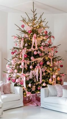 a decorated christmas tree with pink bows and ornaments