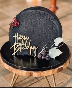 a birthday cake sitting on top of a wooden table