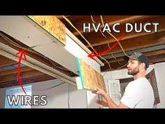 a man is working on some electrical wiring in his house with the words hvac duct above him