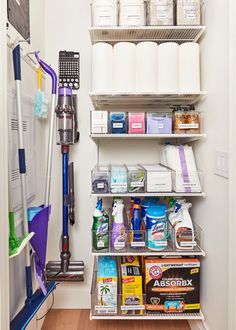 an organized pantry with cleaning supplies and other items