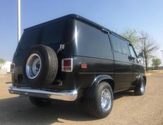 a black van parked in a parking lot