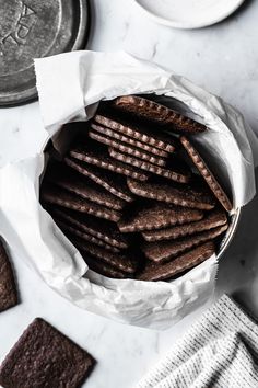 a bowl filled with cookies on top of a table