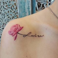 a woman's shoulder with the word june tattooed on her left arm and a pink flower