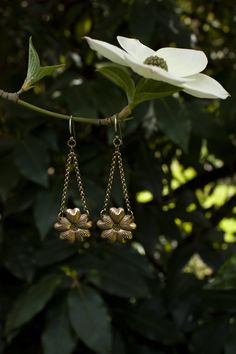 These are wonderfully detailed dogwood flower earrings for all you fellow dogwood tree lovers, flower lovers, and botanical besties out there. They are a great medium size dangle earring and are super lightweight, yet durable, made of solid (not plated) raw brass with solid sterling silver ear hooks. There are two finishes you can choose from either with a patina to enhance the antique feel and highlight the texture, or shiny. Please select your preference from the drop down menu length: 2 1/2 i Brass Drop Earrings With Flower Charm, Elegant Brass Flower Earrings Nickel Free, Vintage Gold Earrings With Flower Charm, Brass Flower Charm Earrings, Vintage Flower Charm Dangle Earrings, Brass Flower Earrings For Wedding, Nature-inspired Drop Flower Earrings For Pierced Ears, Nature-inspired Dangle Earrings With Flower Charm, Flower Shaped Brass Wedding Earrings