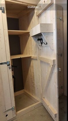 the inside of a wooden closet with shelves