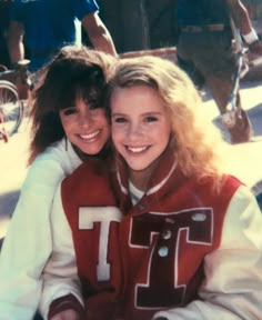 two young women sitting next to each other