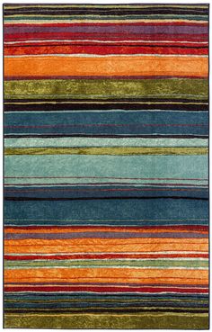 an area rug with multicolored stripes on it