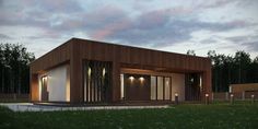 a small wooden building sitting on top of a lush green field