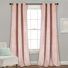 the pink curtains are hanging in front of a window with a white chair next to it