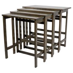 three wooden nesting tables sitting next to each other