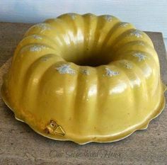 a yellow bundt cake sitting on top of a counter